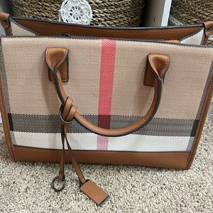 Brand new “designer inspired” handbag.  Lots of compartments and zipper closure.